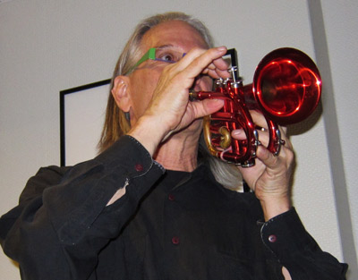 Nik Phelps playing his red trumpet